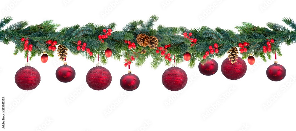 Christmas garland with red hanging balls and berries on isolated white background Christmas garland with red hanging balls and berries on isolated white background