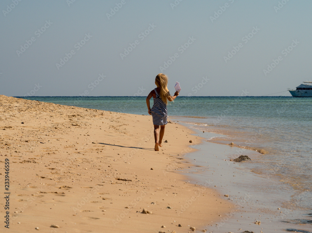 girl running on the beach girl running on the beach