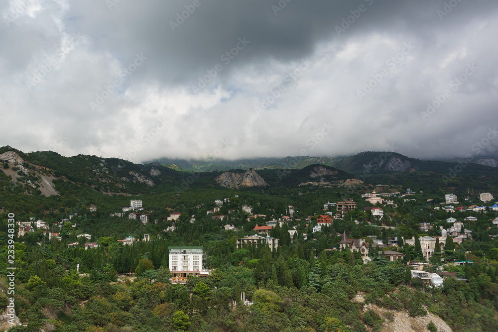 Landscape view from the rock Diva on the resort village Simeiz. Over the tops of the mountains hanging rain clouds