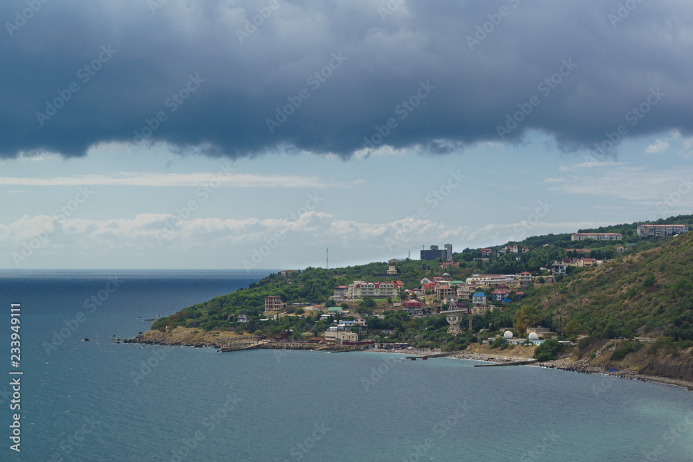 View from the sea to the village of Katsiveli in the Crimea on a summer day