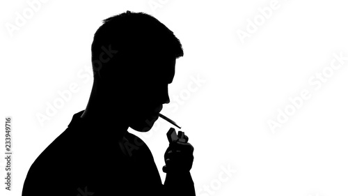 Young male silhouette lighting cigarette and smoking, unhealthy addiction cancer