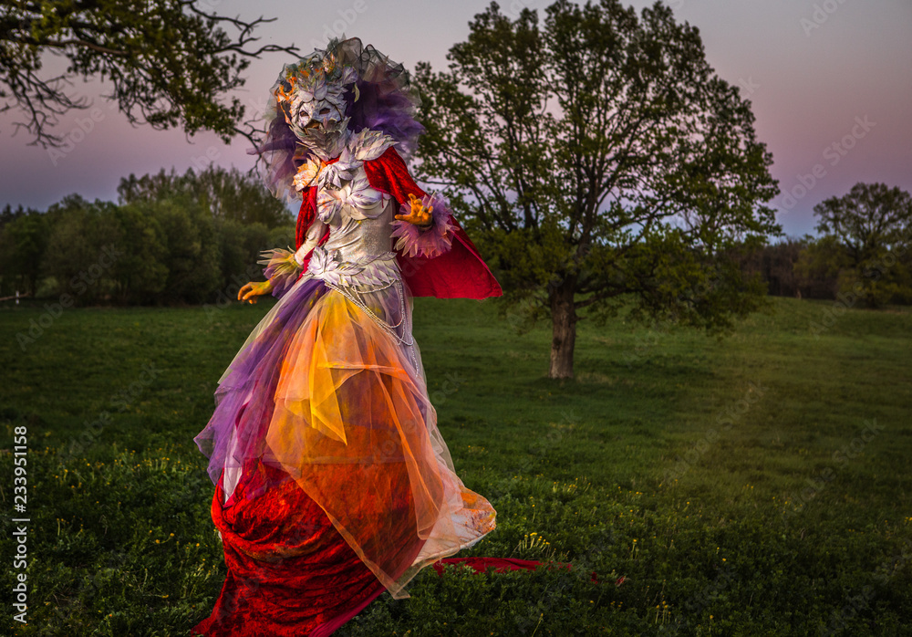 Fairy tale woman on stilts in bright fantasy stylization. Fine art outdoor photo. Fairy tale woman on stilts in bright fantasy stylization. Fine art outdoor photo.