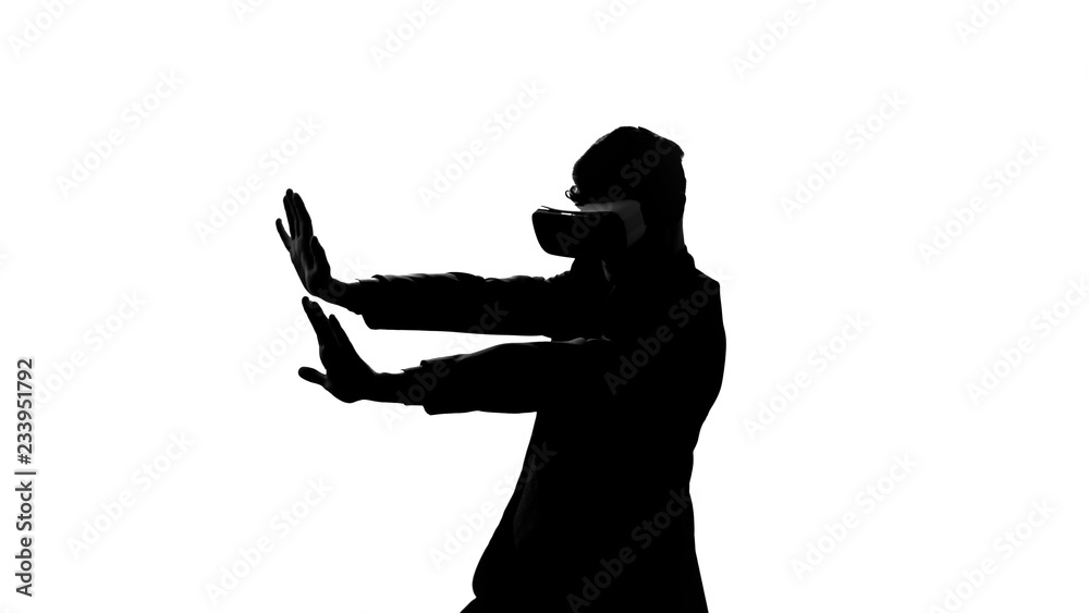 Man in vr headset having dangerous trip in virtual reality, overcome obstacles Man in vr headset having dangerous trip in virtual reality, overcome obstacles