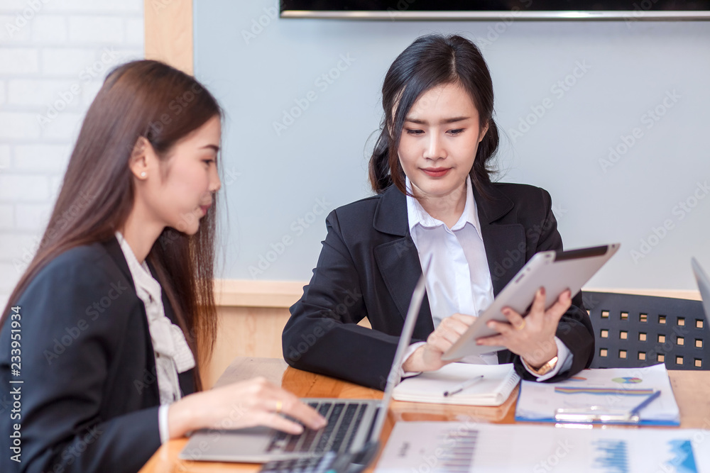 Group of businesswoman working in the office discussing documents and ideas at meeting Group of businesswoman working in the office discussing documents and ideas at meeting