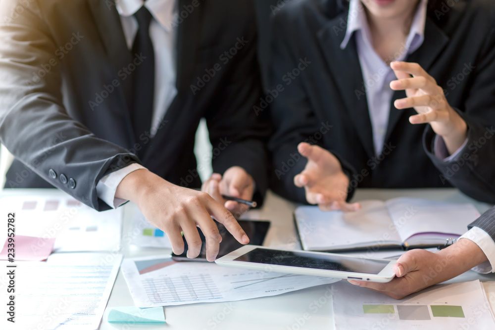 Teamwork process, business people working in the office discussing documents and ideas at meeting Teamwork process, business people working in the office discussing documents and ideas at meeting