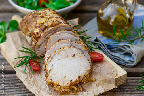 Roast pork loin in mustard marinade with rosemary