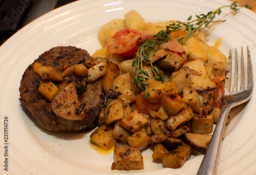 Single portion healthy portion steak and vegetables with mushroom and potato gnocchi