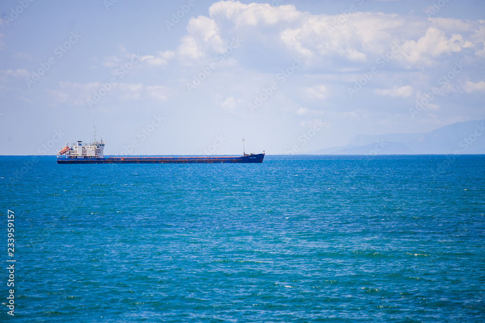 Ship at sea on the background of the Crimean mountains