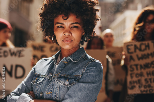 Woman protesting with group of activists photo