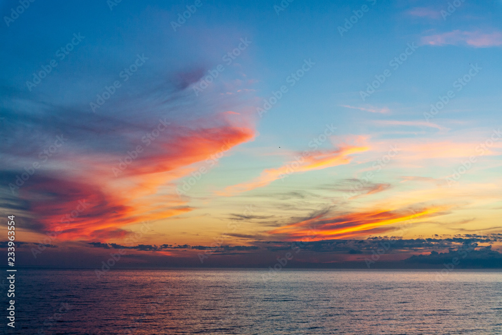 sea beach skyline with clouds and calm water