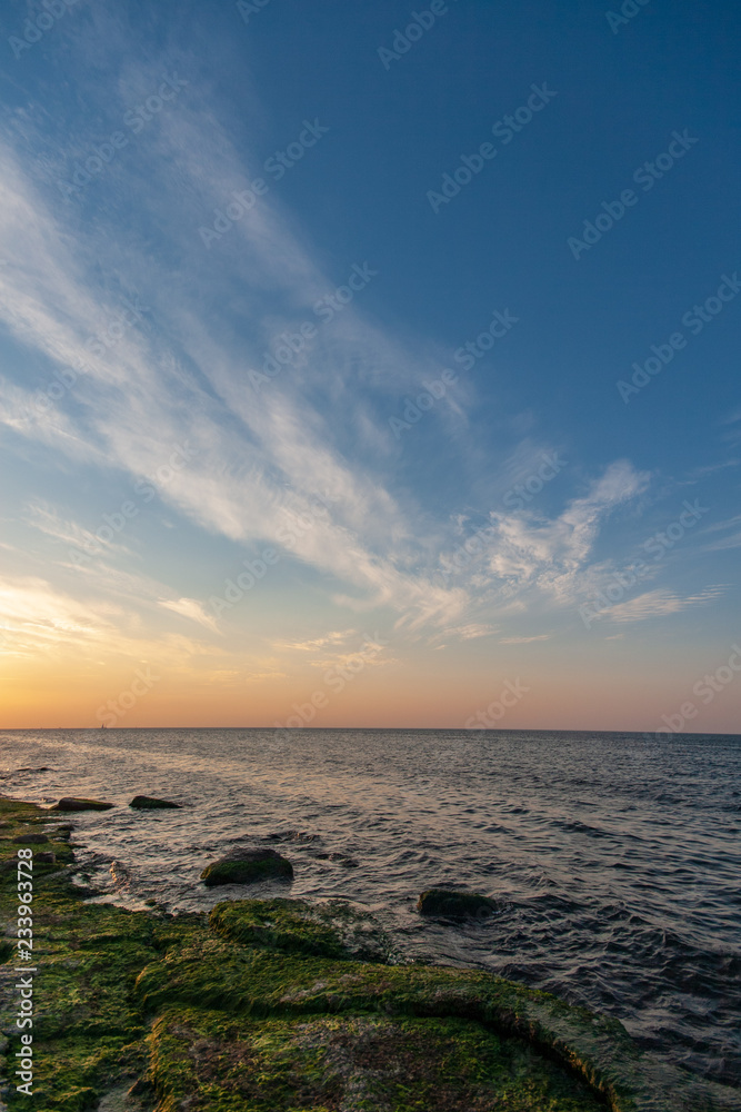 sea beach skyline with clouds and calm water sea beach skyline with clouds and calm water