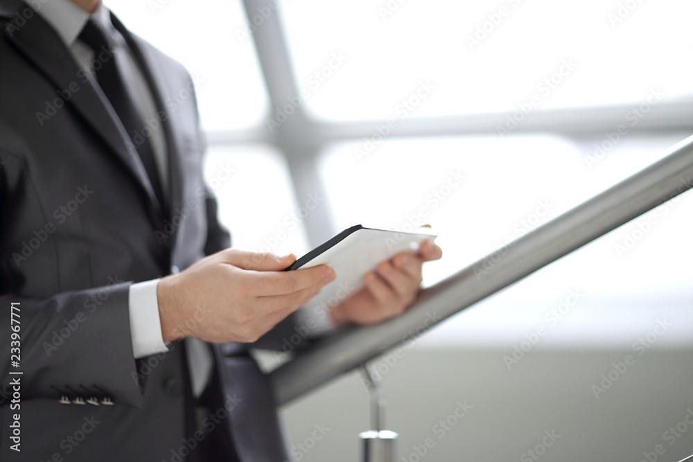 Close-up Of Businessman Looking At Digital Tablet Close-up Of Businessman Looking At Digital Tablet