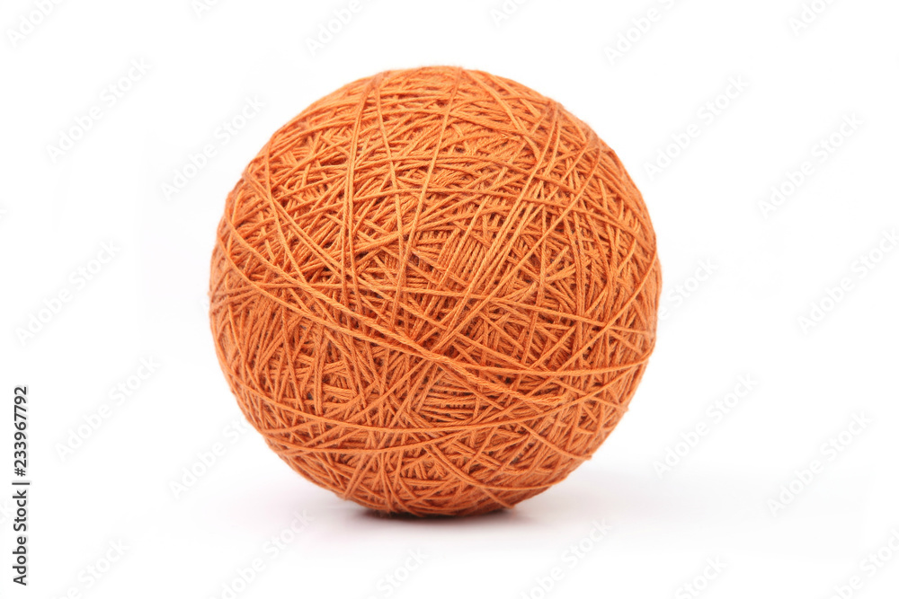 Orange big thread ball isolated on white background. Ball of natural cotton string. Orange big thread ball isolated on white background. Ball of natural cotton string.