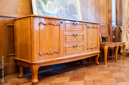 Vintage wooden chest of drawers in retro style
