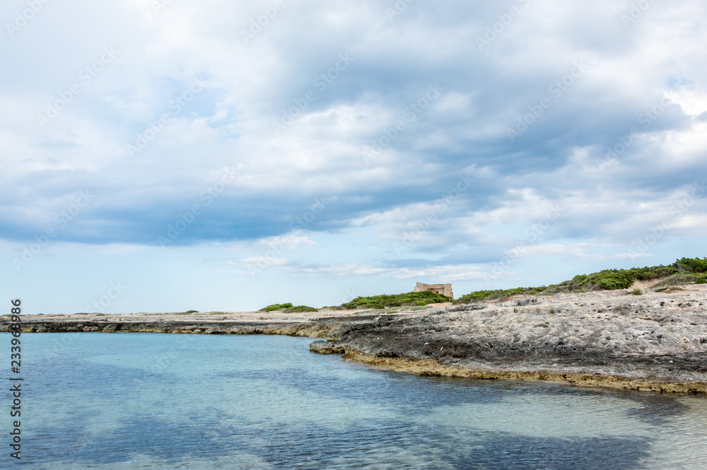 Torre Pozzelle beach and its bay at sunset in Ostuni Salento Italy