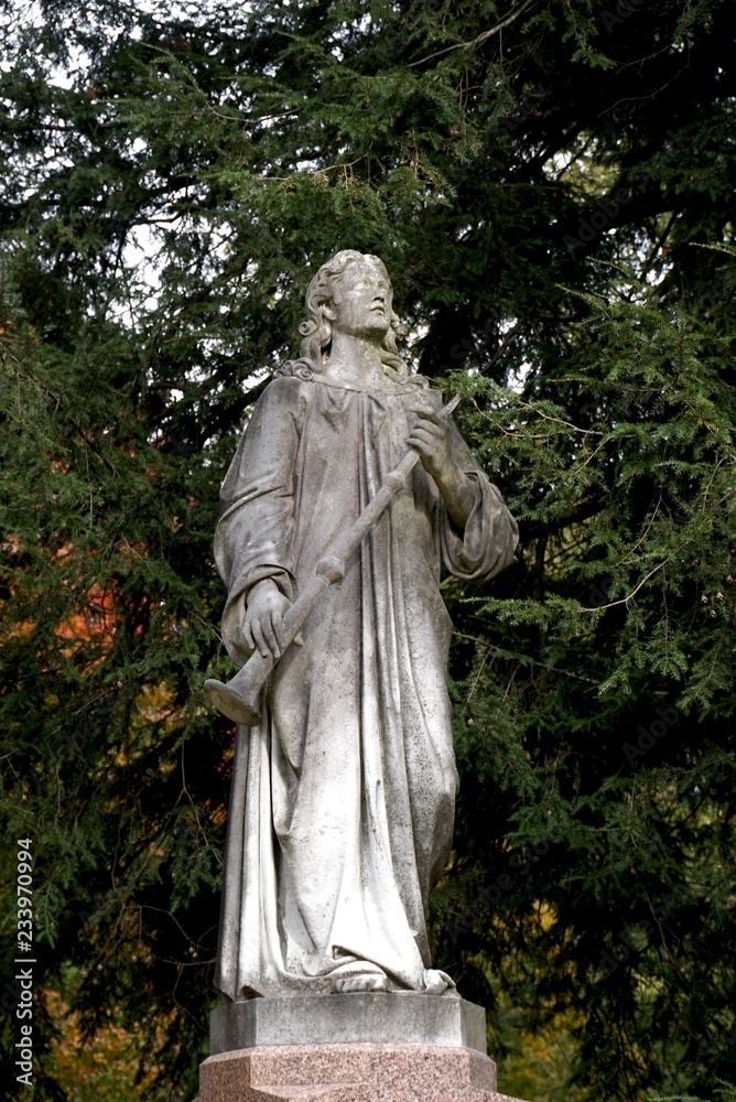 tombstones with angels and figures in victorian graveyard tombstones with angels and figures in victorian graveyard