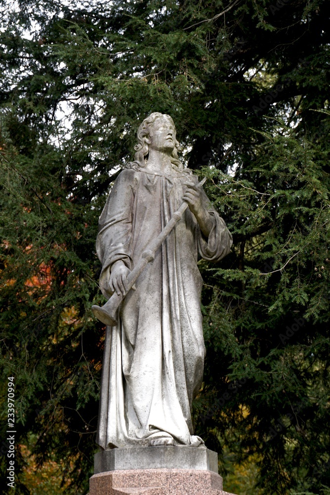 tombstones with angels and figures in victorian graveyard