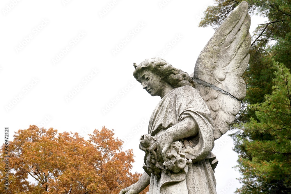 tombstones with angels and figures in victorian graveyard