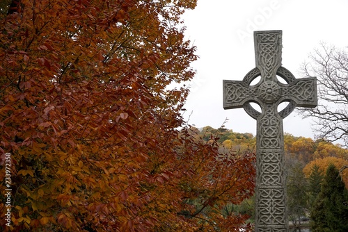 tombstones with celtic and coptic  cross  in victorian graveyard