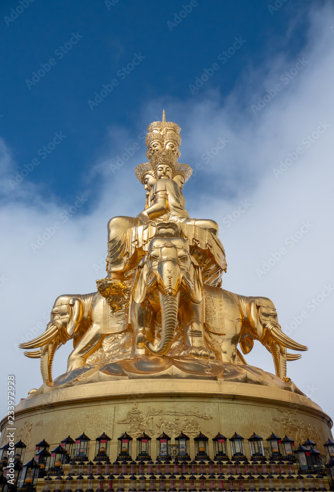 Giant golden Buddha statue on top of Emei Mountain in China