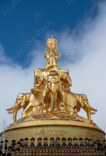 Giant golden Buddha statue on top of Emei Mountain in China