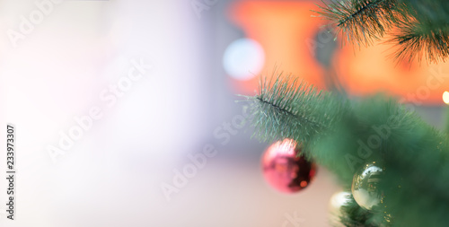 Closeup of Christmas tree with gold and red balls. copyspace