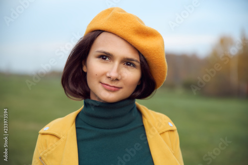 Tablou pe pânză Cute brunette as if having a good idea is planning something