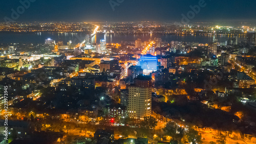 Lights of a big night city. Bird's eye view from drone on cityscape.