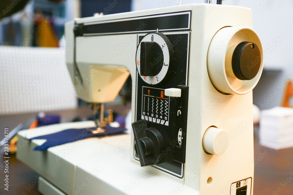 Fototapeta premium White sewing-machine in a tailor´s atelier