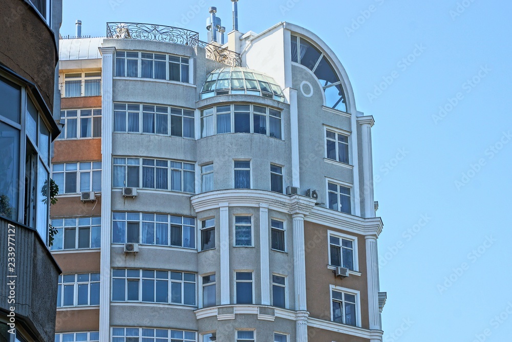 part of a large multi-storey building against the sky part of a large multi-storey building against the sky