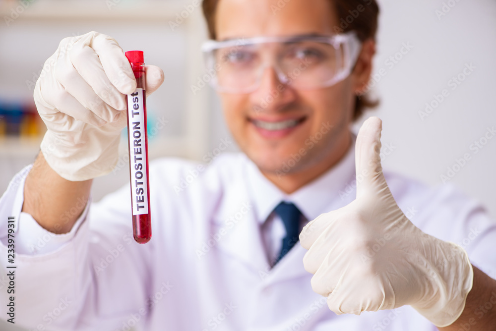 Young handsome lab assistant testing blood samples in hospital Young handsome lab assistant testing blood samples in hospital