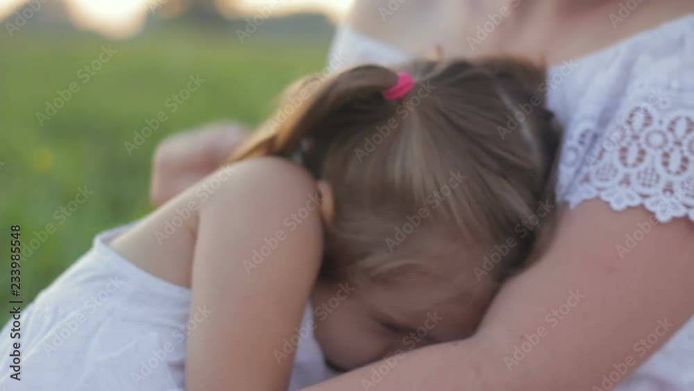 Desperate, hopeless little daughter bursting into tears on tender mom's shoulder Desperate, hopeless little daughter bursting into tears on tender mom's shoulder