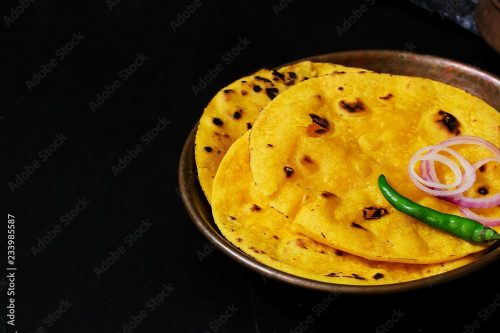 Homemade Makki ki roti / Indian Punjabi corn bread top view - obrazy, fototapety, plakaty 