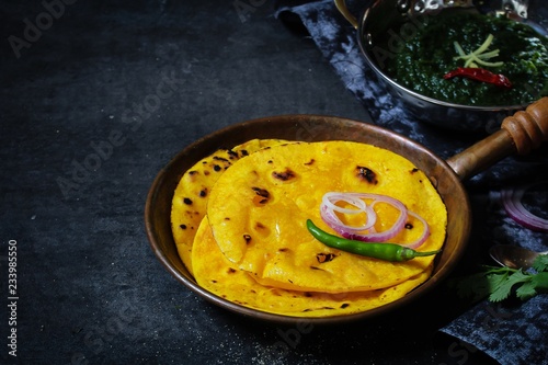 Sarson ka saag and Makki ki roti /Indian corn bread with mustard leaves gravy photo