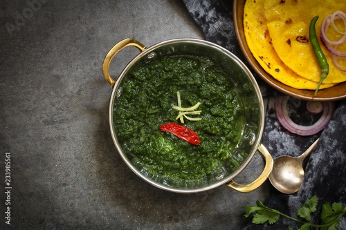 Sarson ka saag and Makki ki roti /Indian corn bread with mustard leaves gravy photo