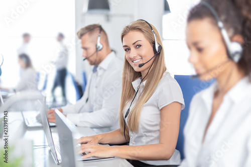 Call center worker accompanied by her team.