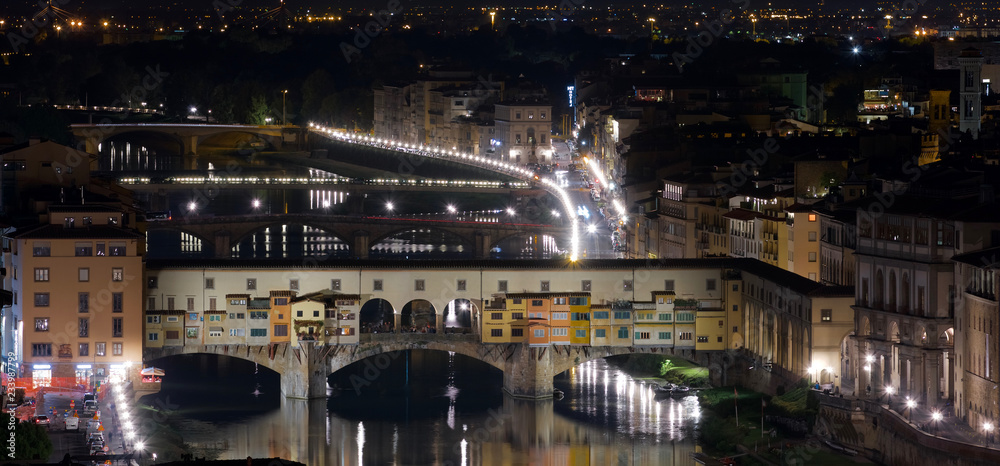 Night view of the Old Bridge, Ponte Vecchio, and the Arno river in Florence, Italy.