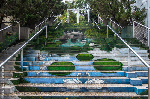 Swans and lake painted on the steps at Kowloon Park, Hong Kong, Tsim Sha Tsu photo