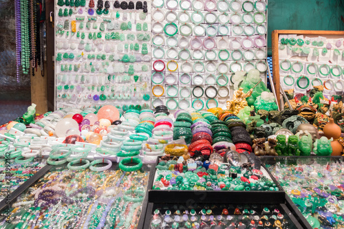 Various pieces of jewelry made of jade displayed at Jade Market, Hong Kong, Kowloon, Yau Ma Tei photo