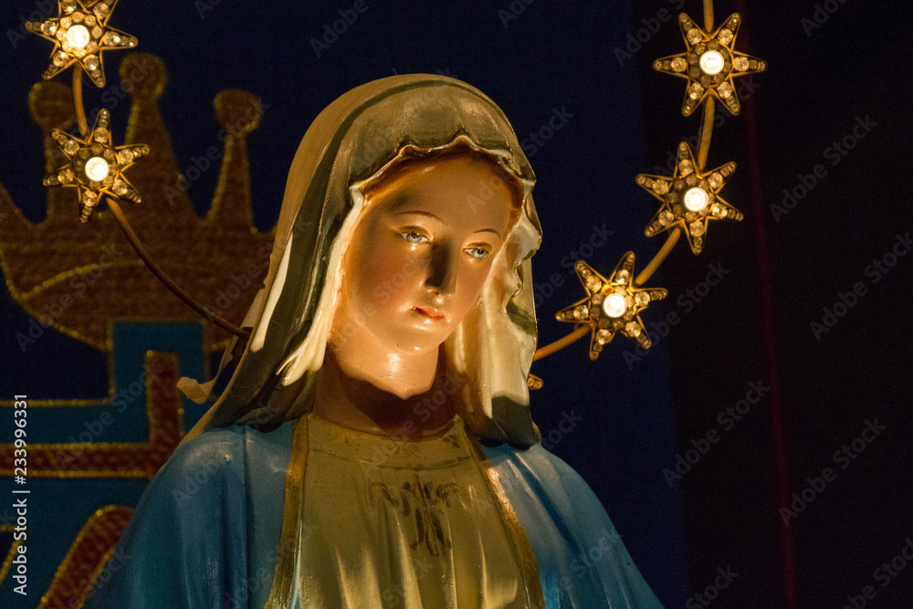Obraz premium Casorate Primo, Italy. 2017/12/8. Notre Dame de Lourdes (Our Lady of Lourdes) - a statue of Virgin Mary in the church of San Vittore Martire.