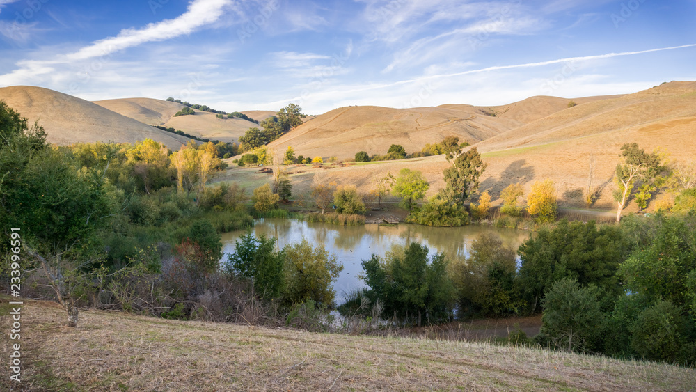 Aerial view of a pond in Garin Dry Creek Pioneer Reginal Park during golden hour, East San Francisco bay, California