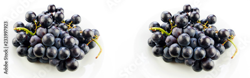  Tasty fresh black grape in a bowl and on white background
