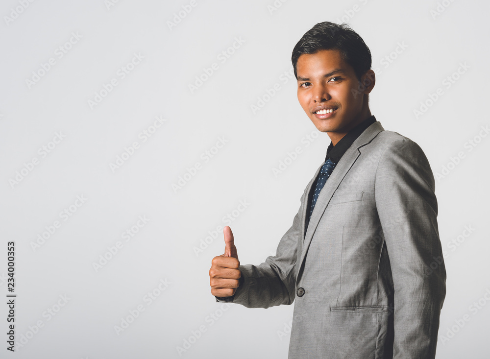 smiling cheerful african american businessman Show Thumbs up