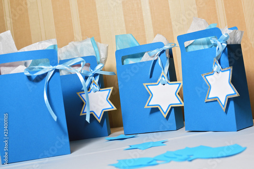 jewish presents in blue paper bags decorated with Star of David photo