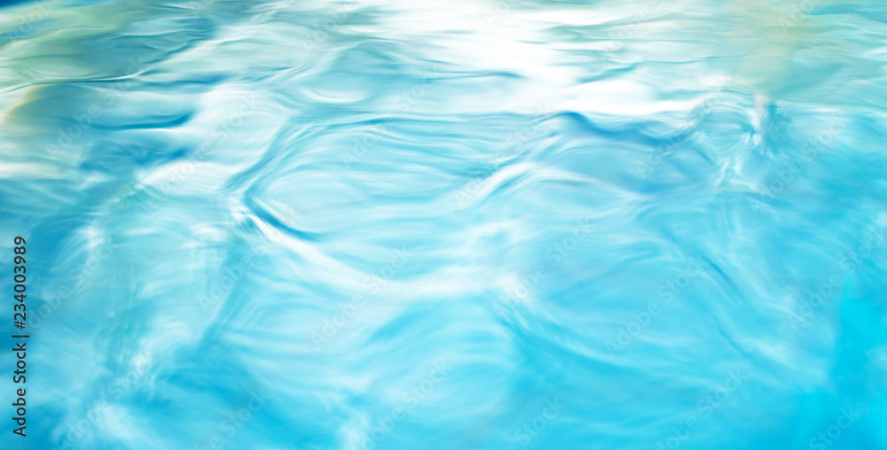 The smooth natural blue water background with bokeh abstract on the sea or ocean,vintage and soft colored blur. The smooth natural blue water background with bokeh abstract on the sea or ocean,vintage and soft colored blur.