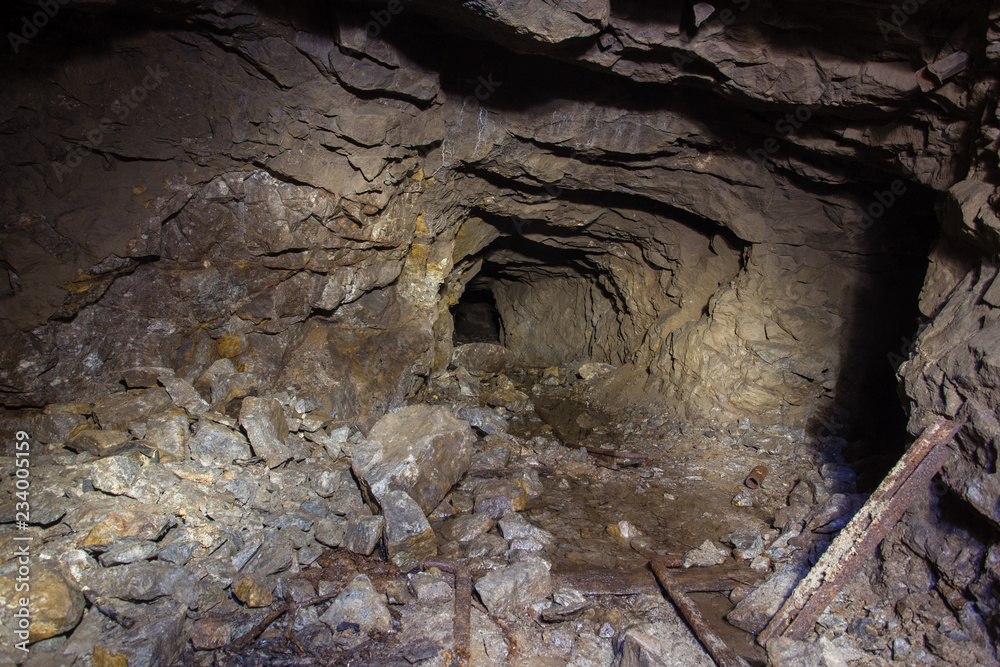 Fototapeta premium Underground abandoned gold iron ore mine shaft tunnel gallery passage