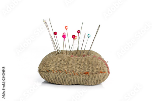 sewing pins on white background. photo