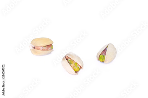 three pistachio on white background.