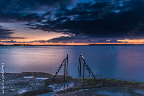 Purple and Orange Dawn Waterscape over the Lake photo