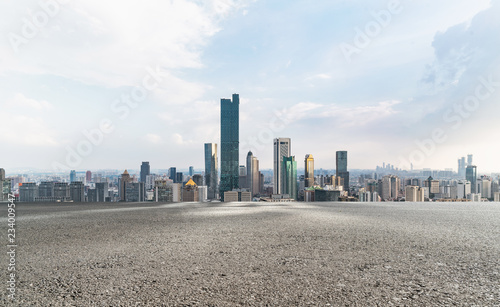 Panoramic skyline and modern buildings with empty road